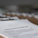 restaurant menus on clipboards close up